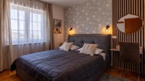 Ένα ή περισσότερα κρεβάτια σε δωμάτιο στο Kalina Deluxe Apartments +54 φωτογραφίες