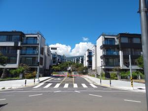 an empty city street with a yellow tram at Healthcare Town Resort in Seogwipo