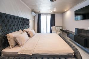 A bed or beds in a room at Luxury Martina apartment