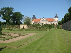 a large house with a garden in front of it at Altstadtapartment in Neuhaldensleben