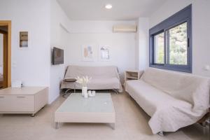 A seating area at Olea Seaside luxury apartment in Crete