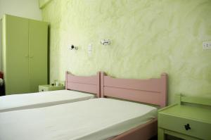 Posteľ alebo postele v izbe v ubytovaní Villas Georgy