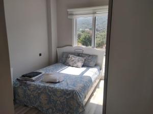 Giường trong phòng chung tại WOLL-ZEYTİN