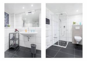 a bathroom with a shower and a sink and a toilet at Top Ausstattung Netflix WLAN CentrO OLGA-Park in Oberhausen +18 photos