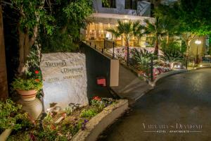 a building with plants and flowers on a street at Varvara's Diamond - Adults Only in Platanes