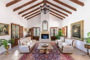 a living room with two couches and a table at La Esperanza Granada Luxury Hacienda & Private Villa in Saleres