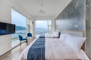 Postelja oz. postelje v sobi nastanitve Sun Moon Lake Shui Yang Hall