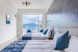 Postelja oz. postelje v sobi nastanitve Sun Moon Lake Shui Yang Hall