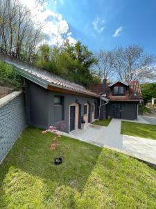 a house with a yard at East Mountain Villa - Private Nature Retreat in Baranja in Batina
