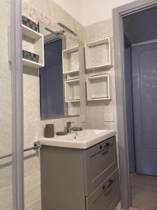 a bathroom with a sink and a mirror at Blue vatican house Rome in Rome