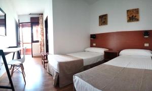 Łóżko lub łóżka w pokoju w obiekcie Hotel Torres Touriño