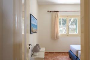 Posteľ alebo postele v izbe v ubytovaní Villa Anemelia by Rodostamo Collection