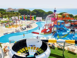 a water park with a water slide and a roller coaster at Grecotel Ilia Palms & Aqua Park in Loutra Killinis
