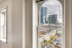 an arched window with a view of a city at South Loop 1br nr L Grant Park CHI-807 in Chicago