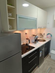 a kitchen with a sink and a counter at Nahorevska vikendica in Sarajevo