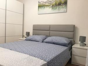 Postel nebo postele na pokoji v ubytování Apartment Nela