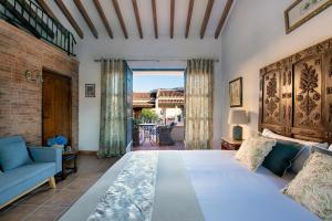 A bed or beds in a room at La Esperanza Granada Luxury Hacienda & Private Villa