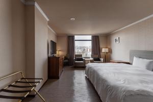 Postel nebo postele na pokoji v ubytování Hotel j-Metropolis