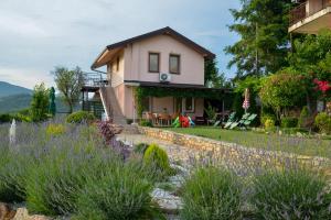 a house with a garden in front of it at Villa Silva in Ohrid