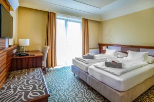 Voodi või voodid majutusasutuse Relax Resort Hotel Kreischberg toas