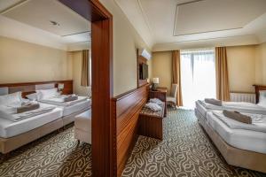 Voodi või voodid majutusasutuse Relax Resort Hotel Kreischberg toas
