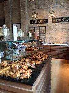 a bakery with a bunch of pastries on a counter at Elegantia Luxury Rooms in Rome
