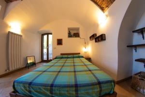 a bedroom with a large bed in a room at Officine Bordighera in Bordighera
