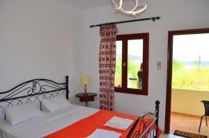 Postel nebo postele na pokoji v ubytování Dimitra Apartments