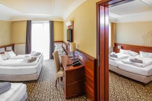 Voodi või voodid majutusasutuse Relax Resort Hotel Kreischberg toas