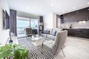 a living room with a couch and a table at Apartamento Alma in Puerto del Carmen