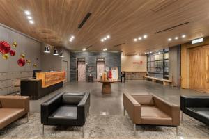 a lobby with couches and a table in a building at Hotel j-Metropolis in Hsinchu City