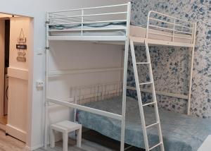 a room with bunk beds with a ladder at ON BOARD in Piran