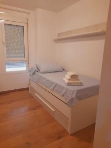 Posteľ alebo postele v izbe v ubytovaní Apartamento Fabricio