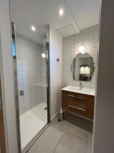 a bathroom with a shower and a sink and a mirror at Five and You in Josse +88 photos