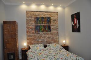Łóżko lub łóżka w pokoju w obiekcie Krakowsky Apartment