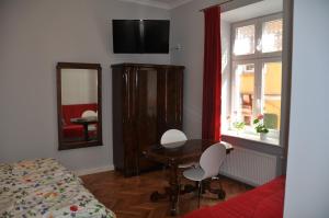 Łóżko lub łóżka w pokoju w obiekcie Krakowsky Apartment