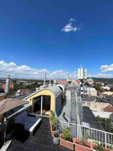 a building on top of a roof of a city at Rooftop - Vienna View in Klosterneuburg
