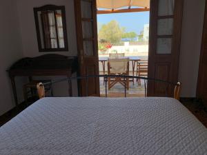 Postel nebo postele na pokoji v ubytování Siroco Patmos