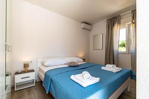 Ένα ή περισσότερα κρεβάτια σε δωμάτιο στο Villa Blue Panorama +44 φωτογραφίες