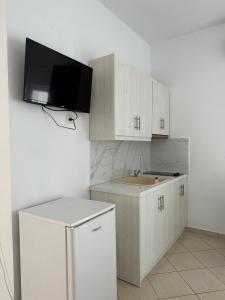 Kuchyň nebo kuchyňský kout v ubytování Joni Apartments
