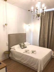 Кровать или кровати в номере Siboni Luxury Rooms - Adults Only
