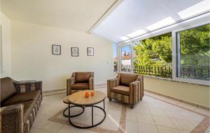 a living room with a couch and chairs and a table at 4 Bedroom Amazing Home In Zaboric in Zaboric