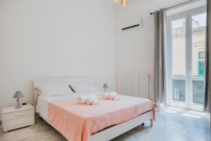 Postel nebo postele na pokoji v ubytování B&B Nuovo Reale - CENTRO STORICO