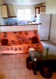 a living room with a couch in a kitchen at Appartement confortable à Sainte-Luce, 50m², parking inclus. in Sainte-Luce +18 photos
