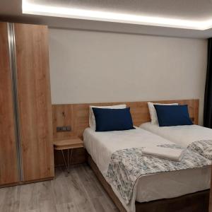 Postel nebo postele na pokoji v ubytování Dab Hotel Ulus