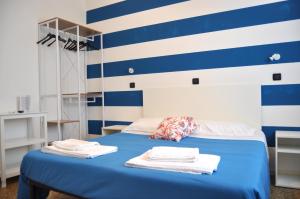 Postel nebo postele na pokoji v ubytování Hotel Susy - Ambienti rinnovati - direttamente su viale Dante e a due passi dal mare
