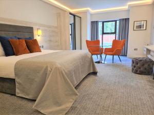 Postel nebo postele na pokoji v ubytování Mill Park Hotel