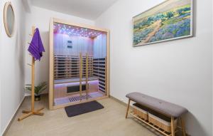 a room with a sliding glass door to a balcony at Nice Home In Soboli, Cavle With Sauna in Soboli +26 photos