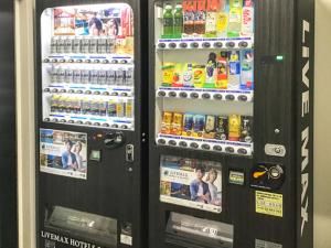 a black vending machine with drinks and drinks at HOTEL LiVEMAX Asakusa-Ekimae in Tokyo