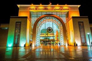 a large building with a lit up facade at night at Marrakchia apartment Guéliz in Marrakesh